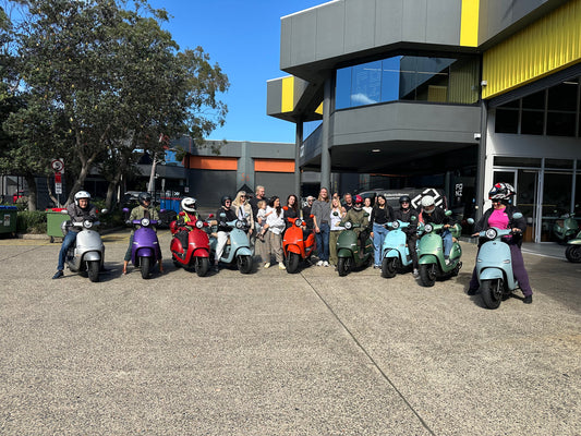 FONZ riders lined up on their scooters outside FONZ HQ for International Women's Day