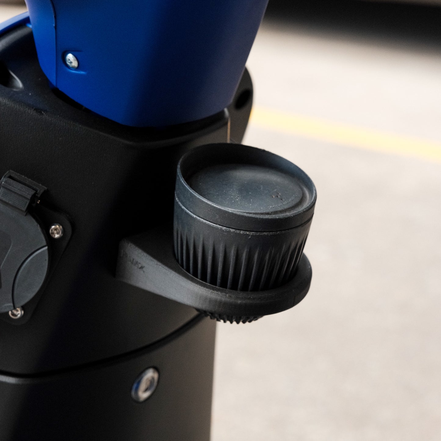 FONZ cup holder for Arthur and Z Series scooters holding a drink