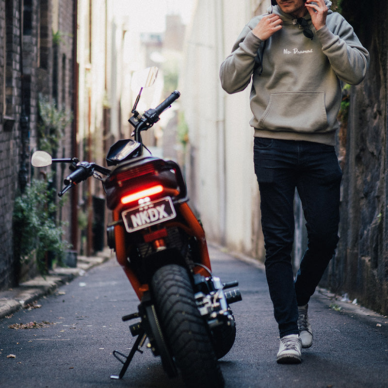 FONZ NKD electric motorbike with Motogadget glassless mirrors parked in a laneway