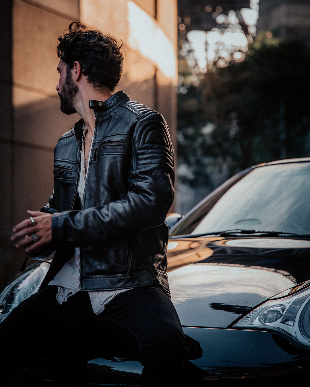 Merla Moto Wakefield men's leather motorcycle jacket, worn beside a car